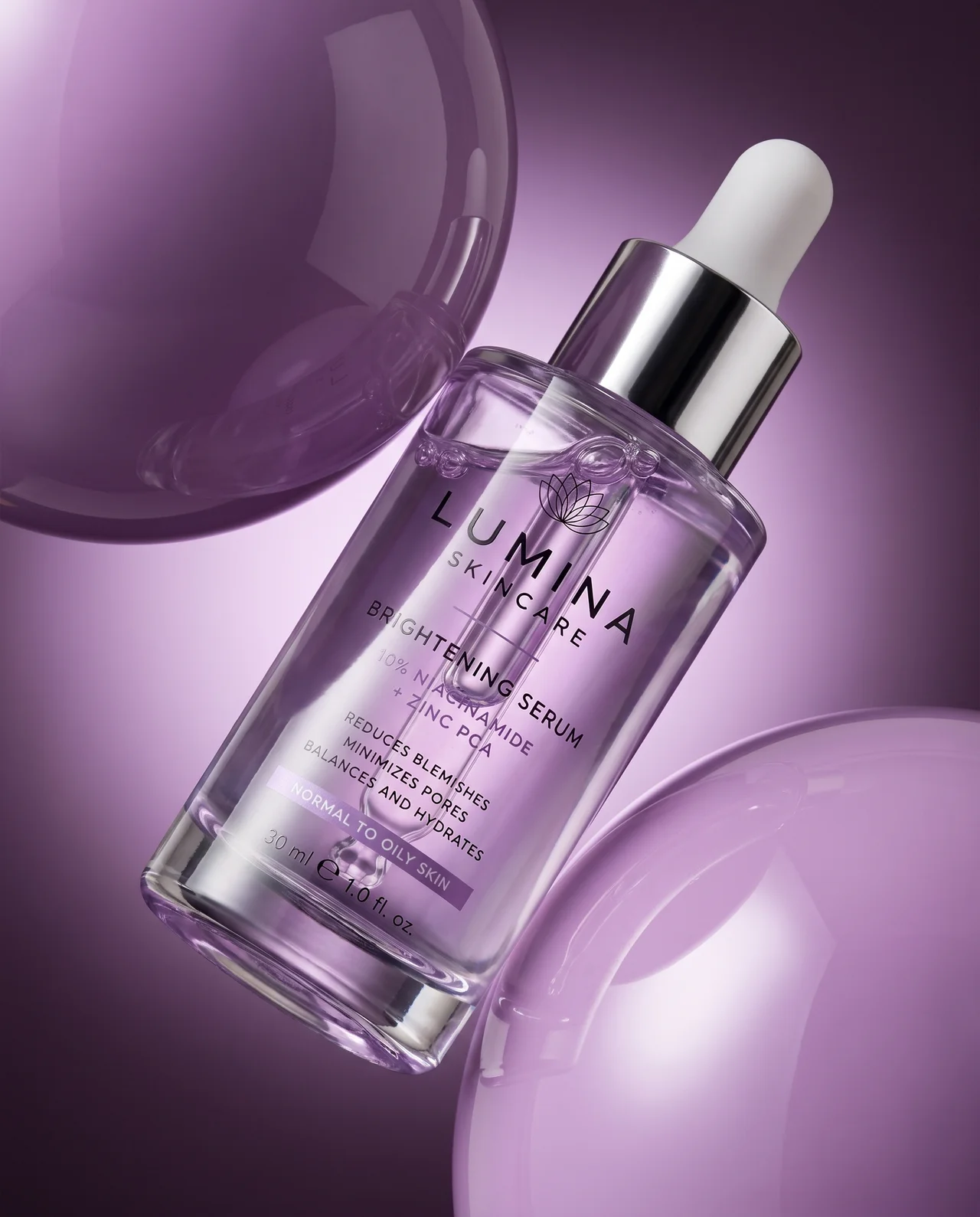 Skincare hero — Lumina brightening serum among purple glass spheres
